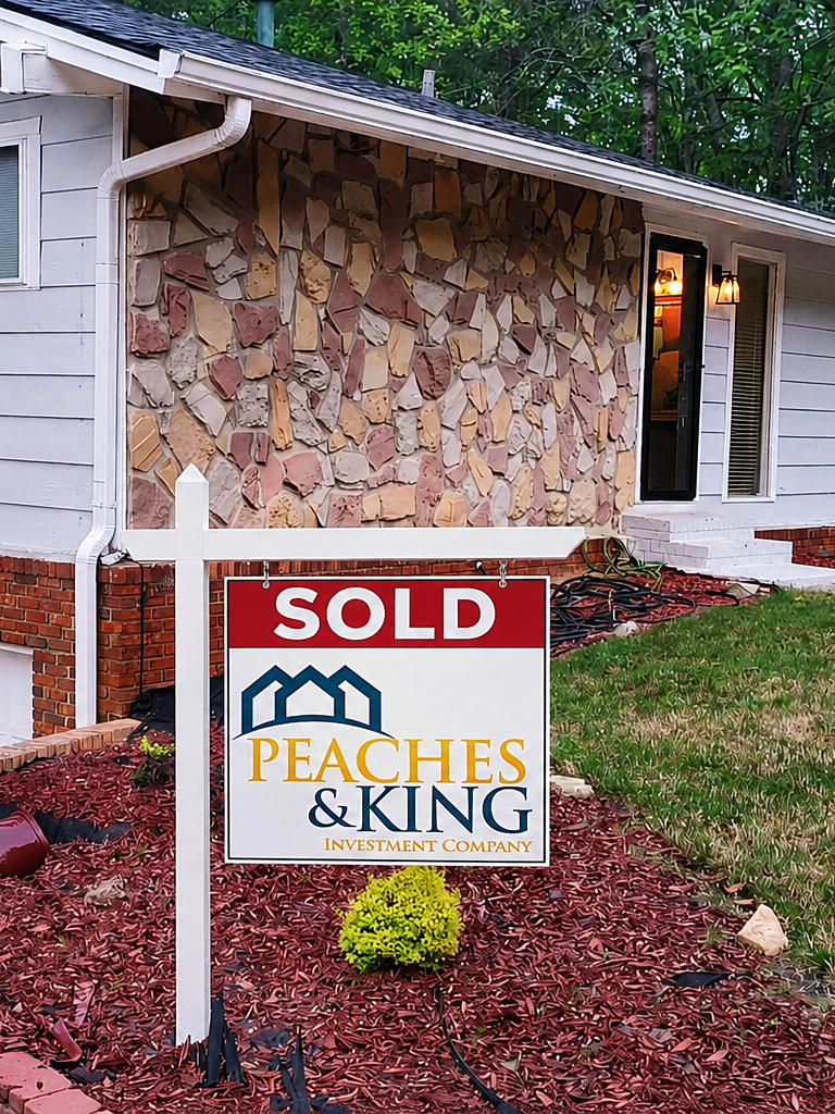 A property showcased by Peaches & King, with the original sold sign.